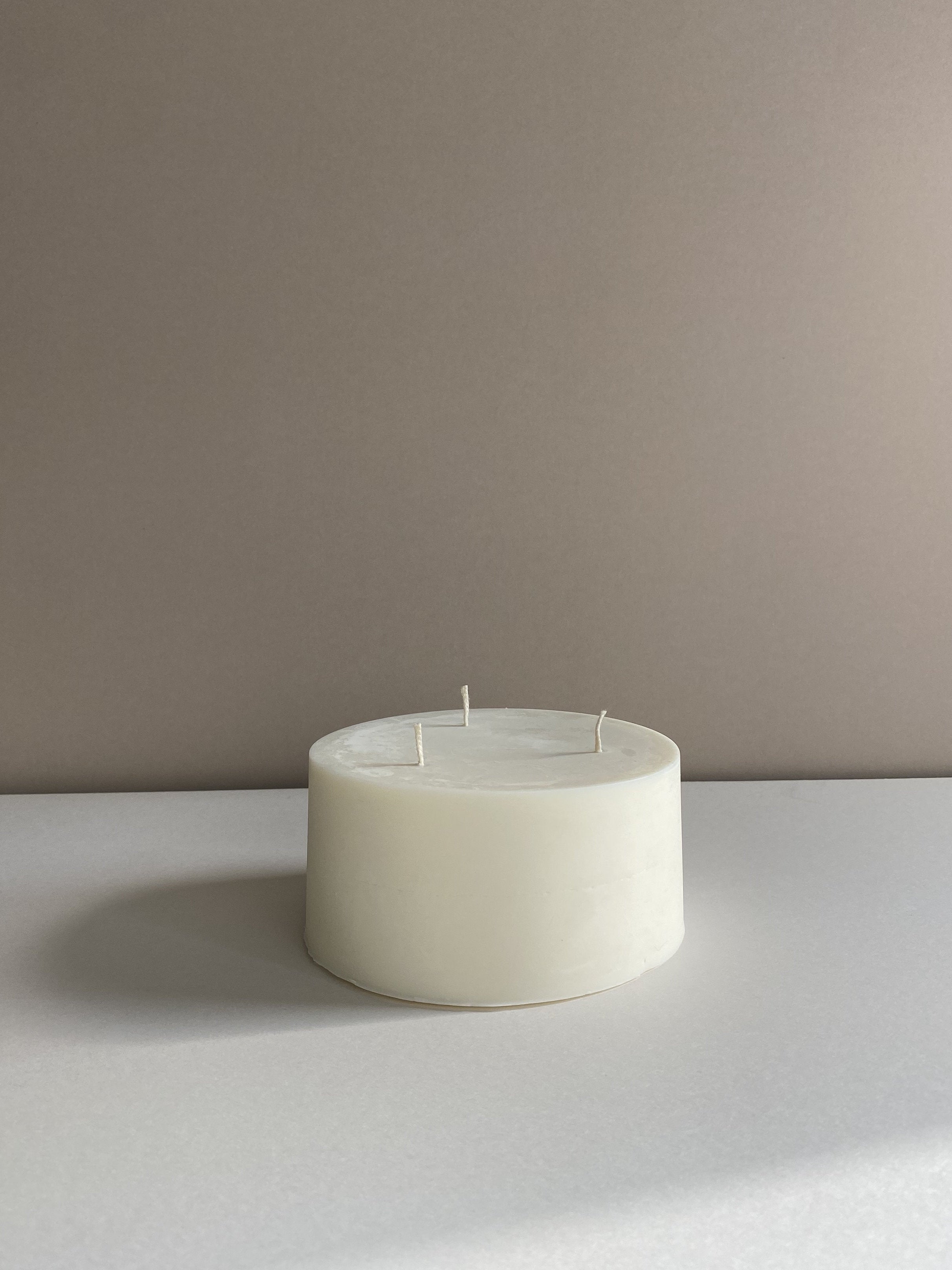 Atelier Ethos Large Pillar Candle A three-wick candle in natural soy wax, wide and sculptural, radiating warmth and elegance. Crafted sustainably, with 10% of profits supporting charity. £20.00