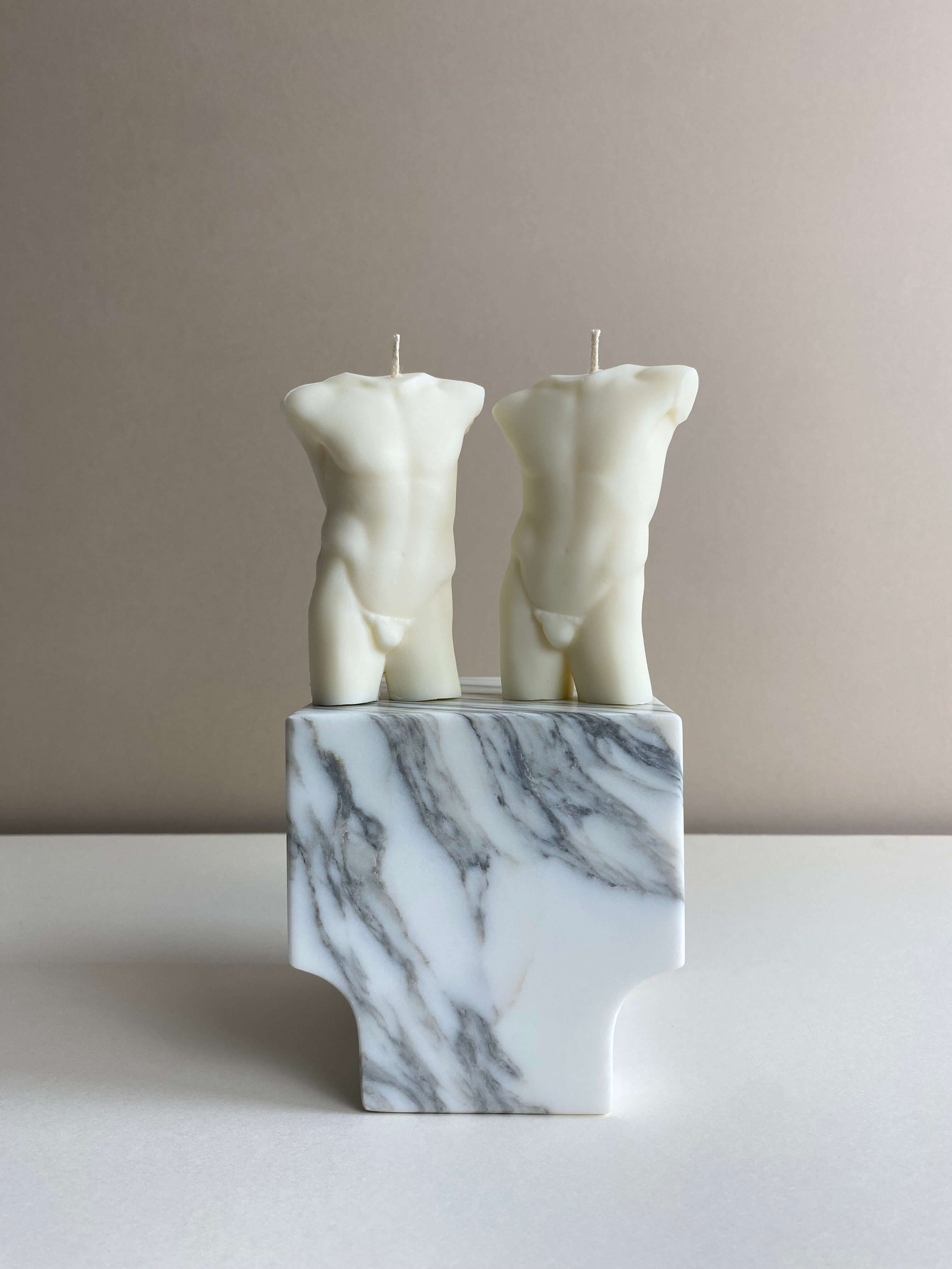 Atelier Ethos Pair Of Male Torso Candles A candle duo in natural soy wax showcasing sculptural elegance and refined craftsmanship. Perfect for weddings or engagement gifts. Sustainable, luxurious, with 10% of profits donated to charity. £18.00