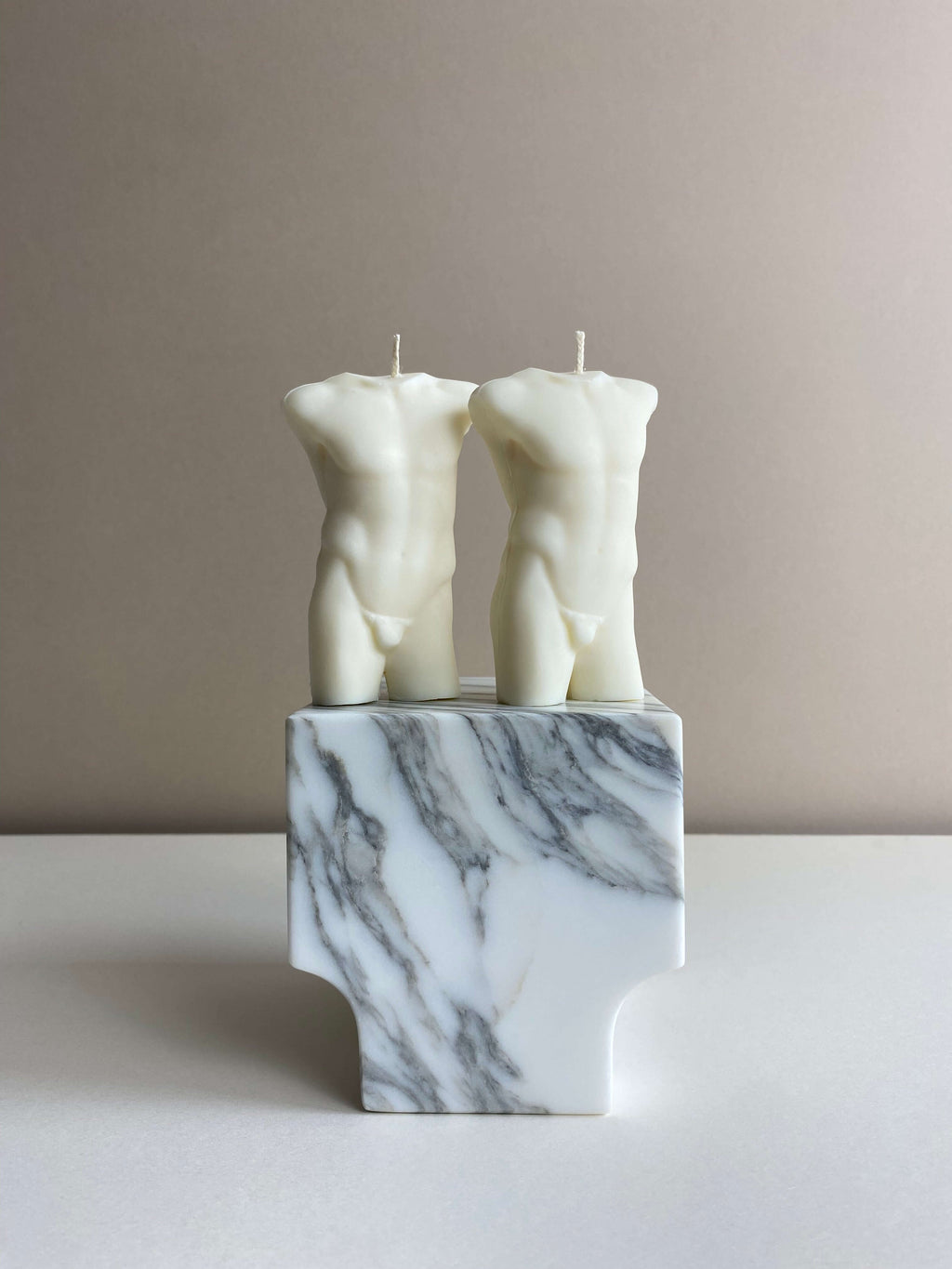 Atelier Ethos Pair Of Male Torso Candles A candle duo in natural soy wax showcasing sculptural elegance and refined craftsmanship. Perfect for weddings or engagement gifts. Sustainable, luxurious, with 10% of profits donated to charity. £18.00
