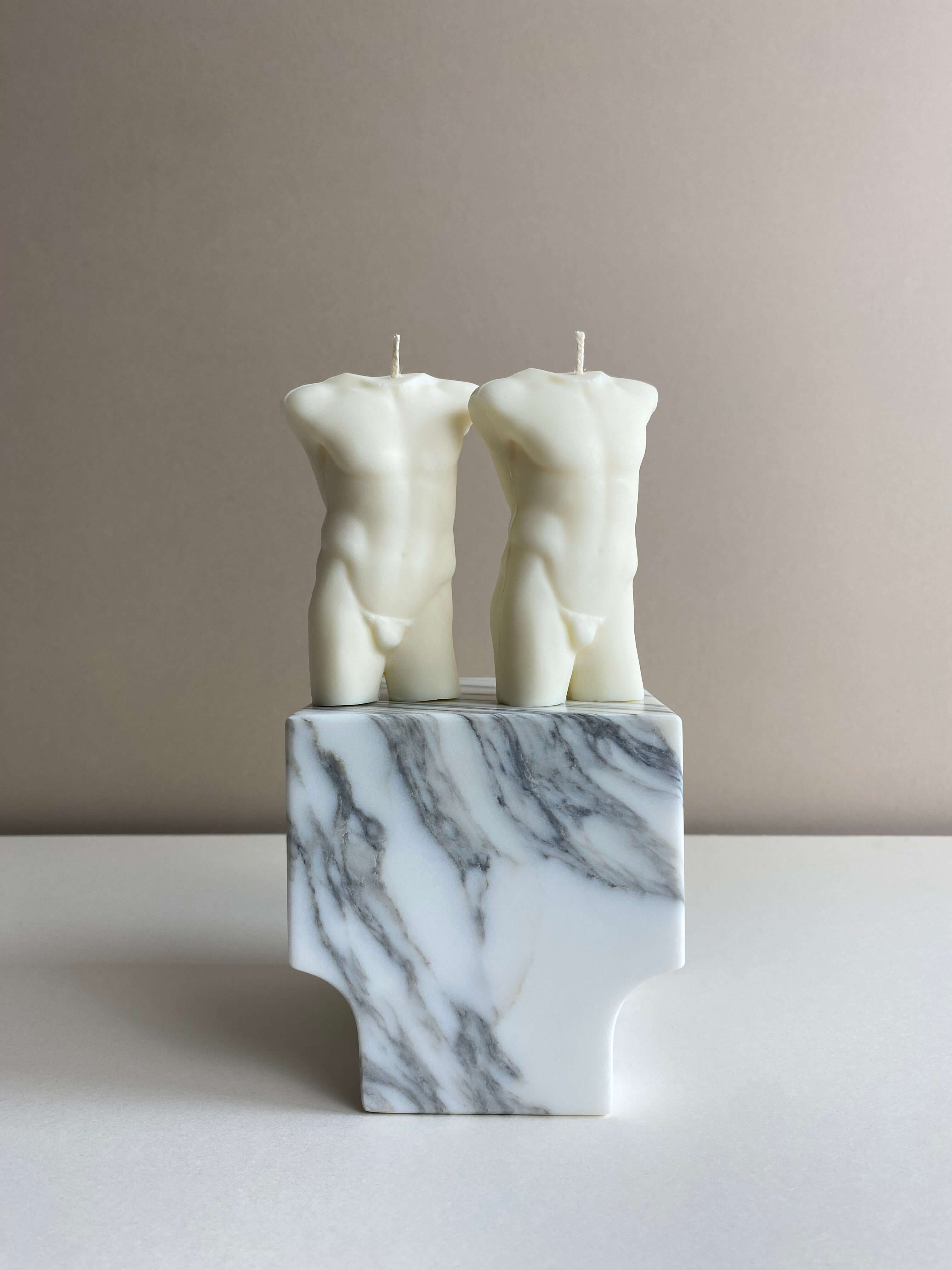 Atelier Ethos Pair Of Male Torso Candles A candle duo in natural soy wax showcasing sculptural elegance and refined craftsmanship. Perfect for weddings or engagement gifts. Sustainable, luxurious, with 10% of profits donated to charity. £18.00