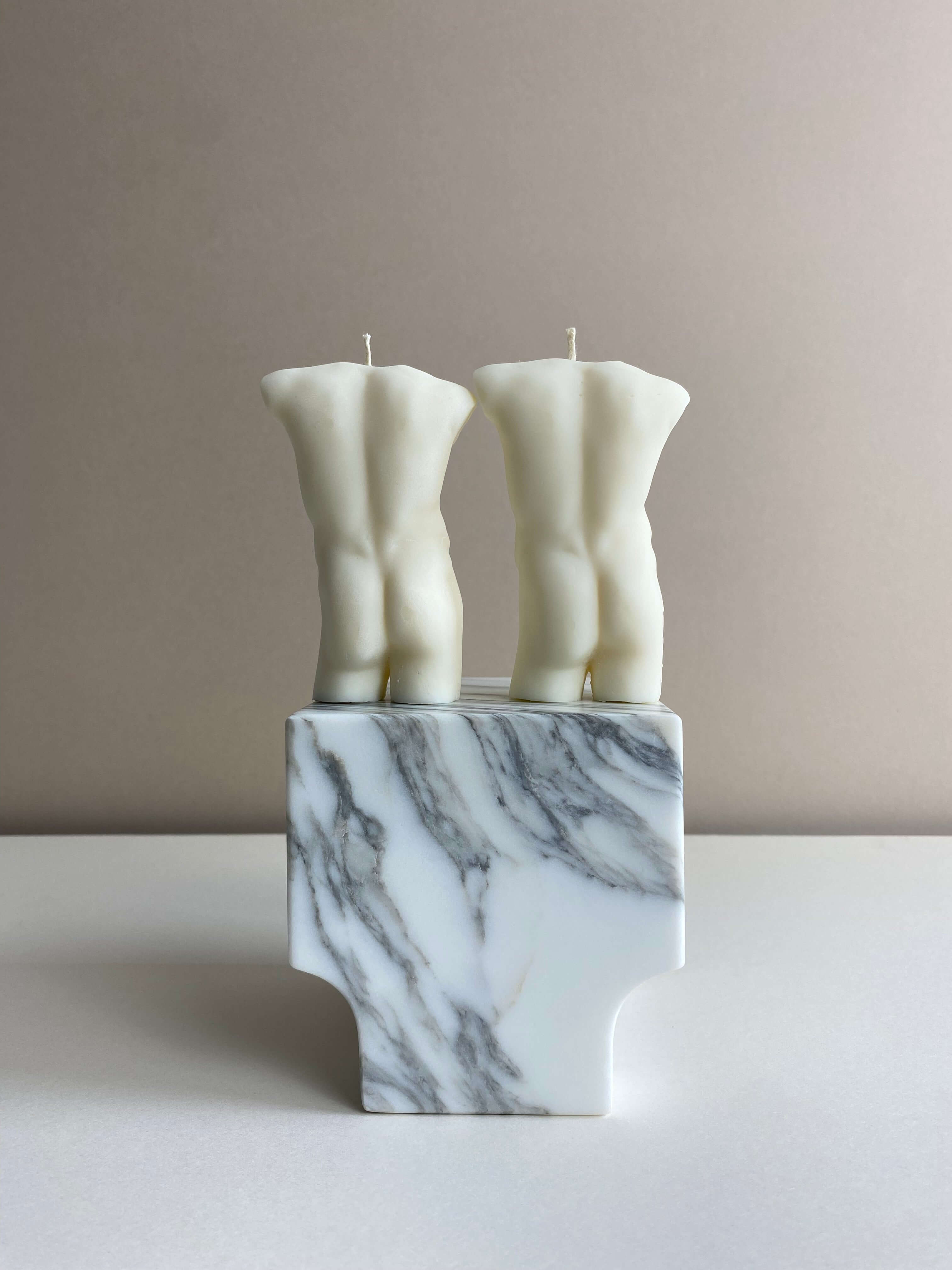Atelier Ethos Pair Of Male Torso Candles A candle duo in natural soy wax showcasing sculptural elegance and refined craftsmanship. Perfect for weddings or engagement gifts. Sustainable, luxurious, with 10% of profits donated to charity. £18.00