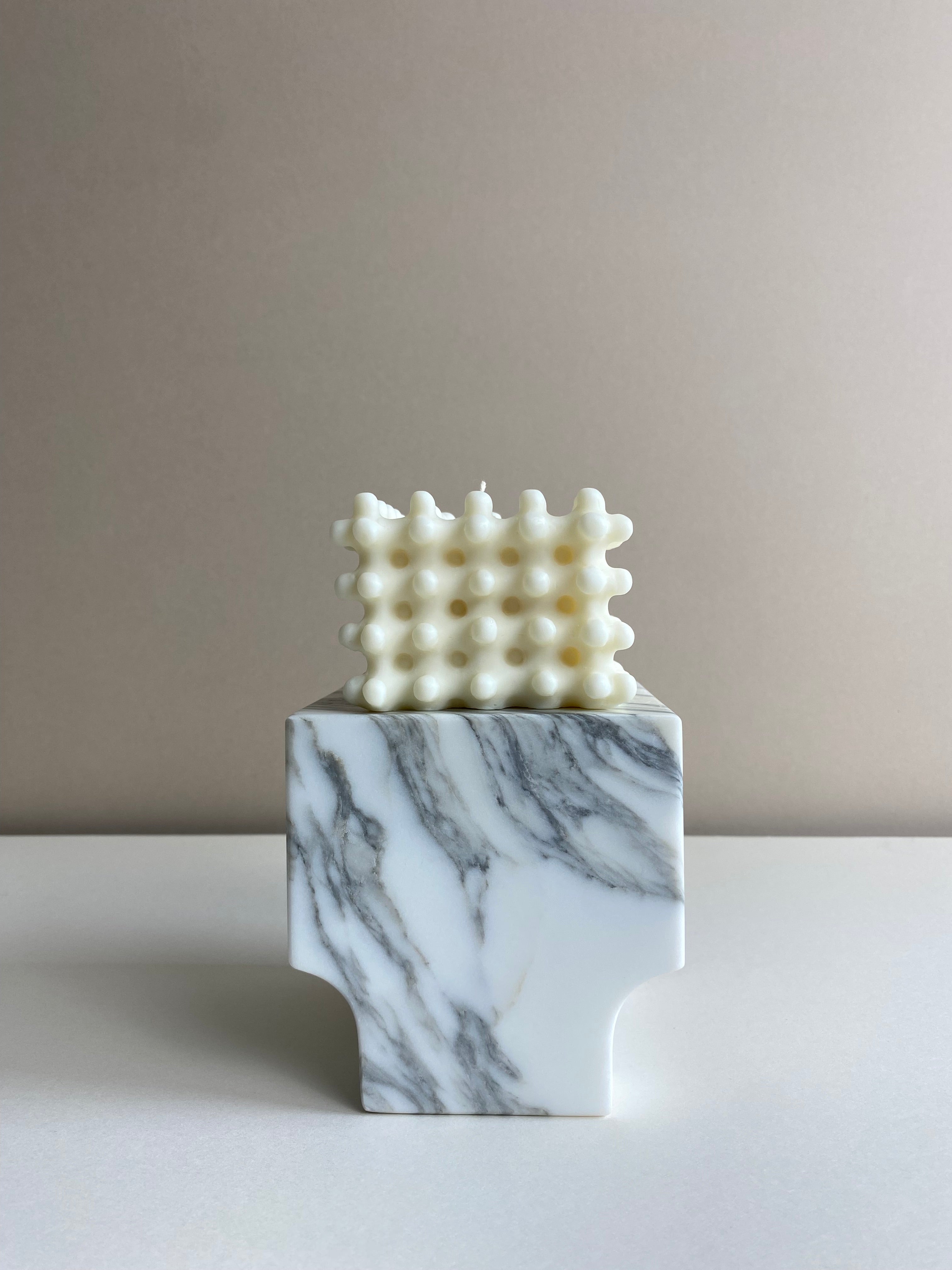 Atelier Ethos Large Nubbed Cube Candle Sculptural and bold, a candle hand-poured in natural soy wax with distinctive rounded nubs. Sustainable, luxurious, and 10% of profits go to charity. £20.00