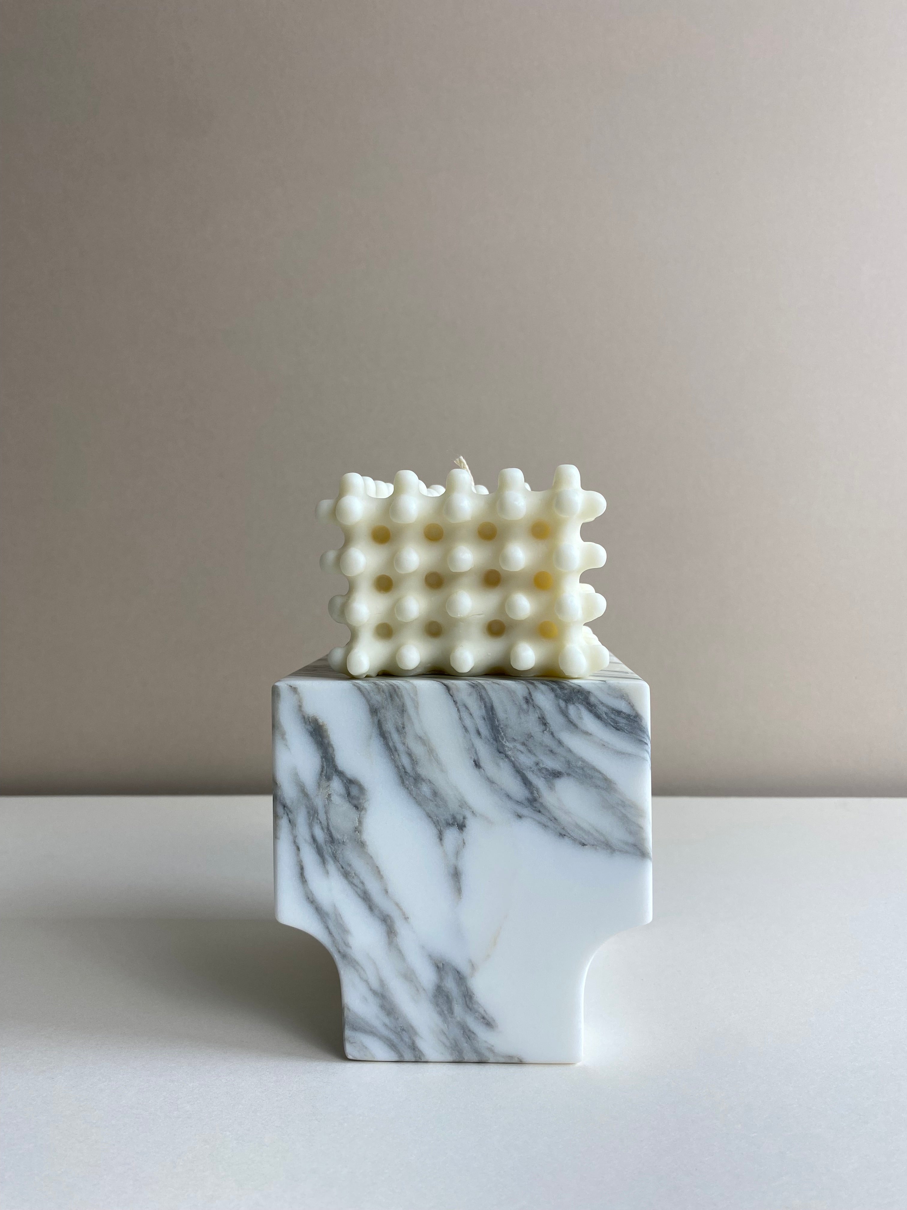 Atelier Ethos Large Nubbed Cube Candle Sculptural and bold, a candle hand-poured in natural soy wax with distinctive rounded nubs. Sustainable, luxurious, and 10% of profits go to charity. £20.00