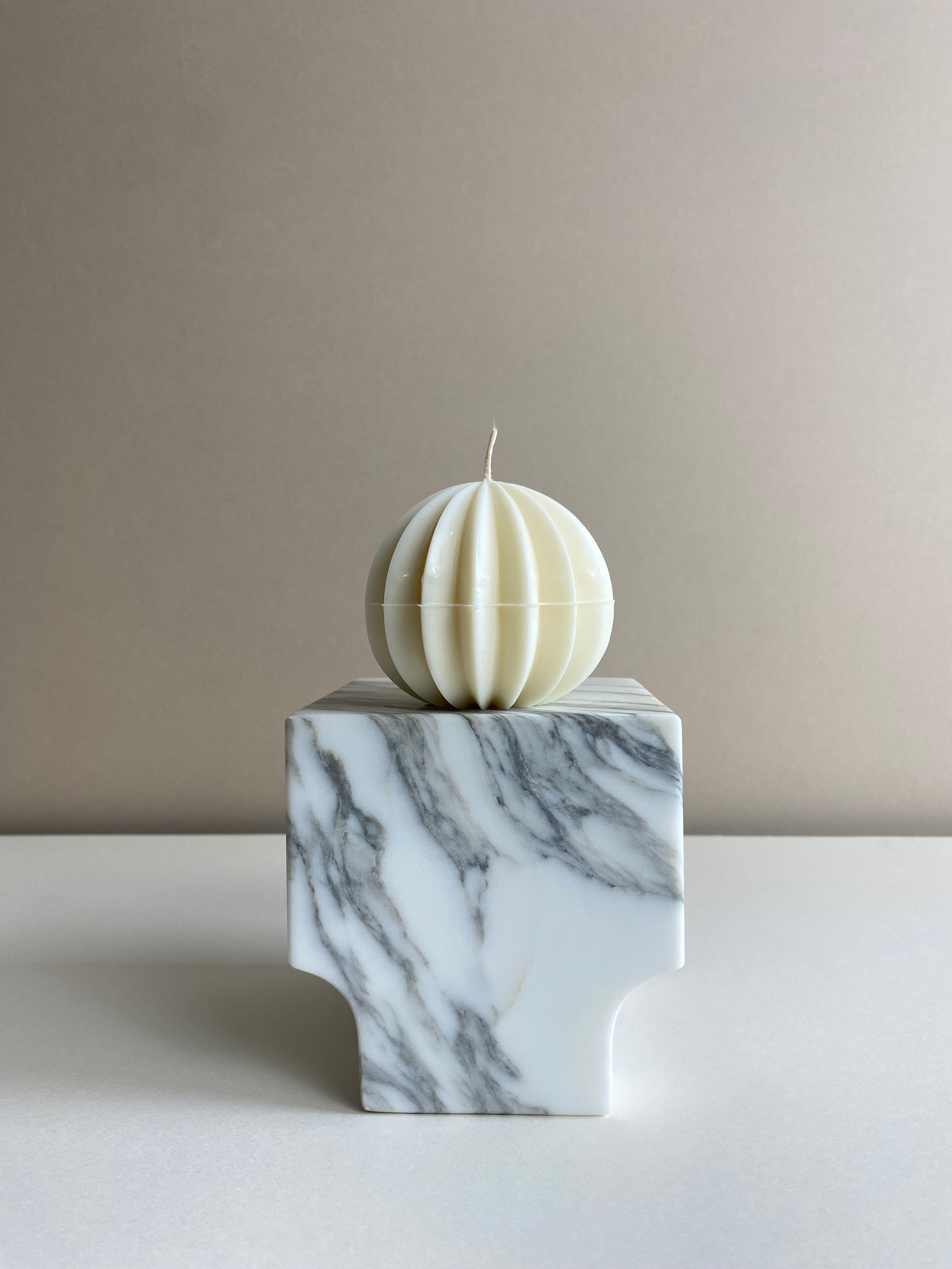 Atelier Ethos Ribbed Sphere Candle Inspired by festive design, a candle in natural soy wax with textured ribs. Luxurious, sustainable, and 10% of profits are donated to charity. £12.00