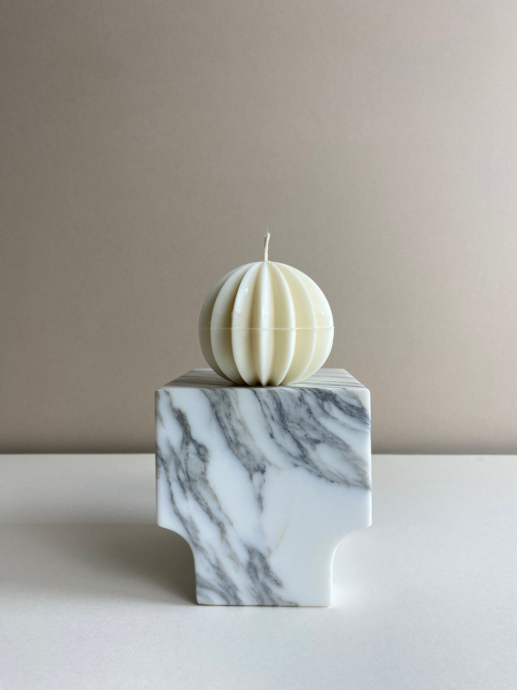Atelier Ethos Ribbed Sphere Candle Inspired by festive design, a candle in natural soy wax with textured ribs. Luxurious, sustainable, and 10% of profits are donated to charity. £12.00