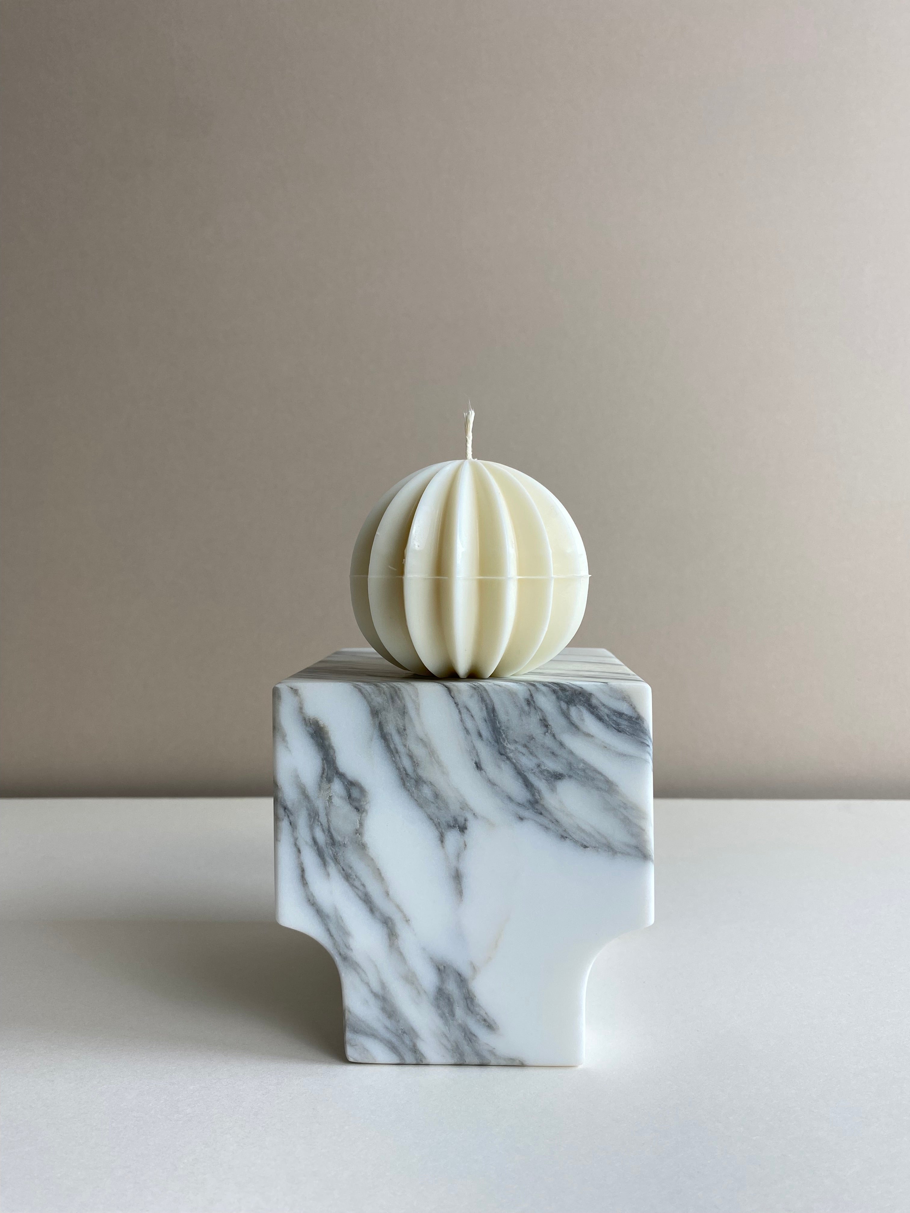 Atelier Ethos Ribbed Sphere Candle Inspired by festive design, a candle in natural soy wax with textured ribs. Luxurious, sustainable, and 10% of profits are donated to charity. £12.00
