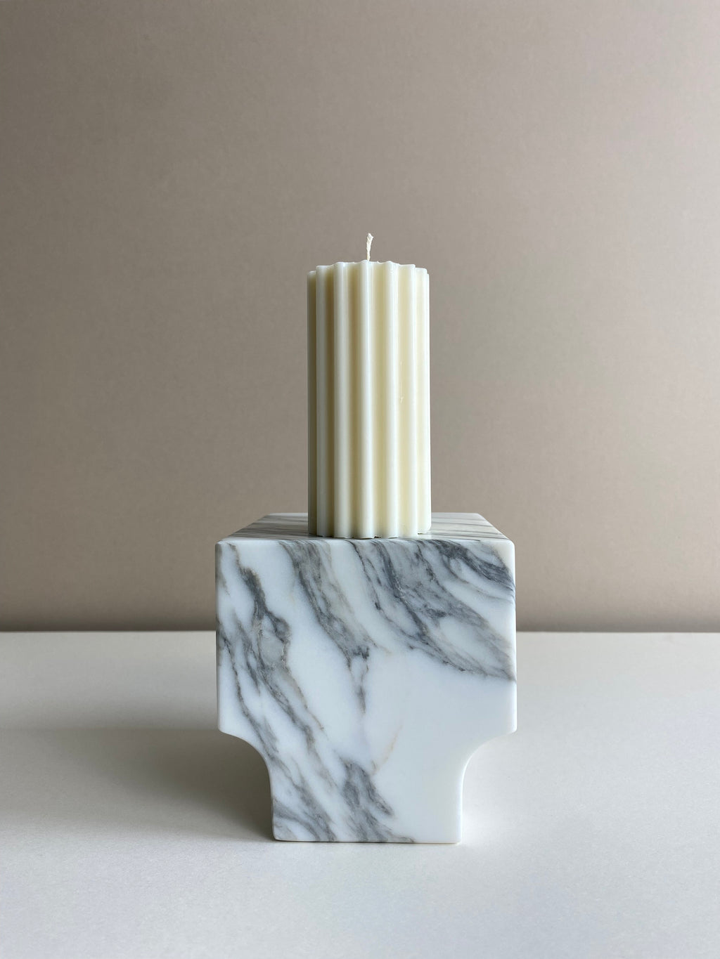 Atelier Ethos Short Ribbed Pillar Candle Compact and refined, a candle in natural soy wax that blends artisanal artistry with luxury. Sustainable and clean-burning, with 10% of profits donated. £12.00