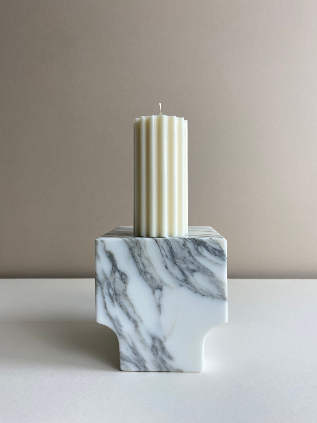 Atelier Ethos Short Ribbed Pillar Candle Compact and refined, a candle in natural soy wax that blends artisanal artistry with luxury. Sustainable and clean-burning, with 10% of profits donated. £12.00