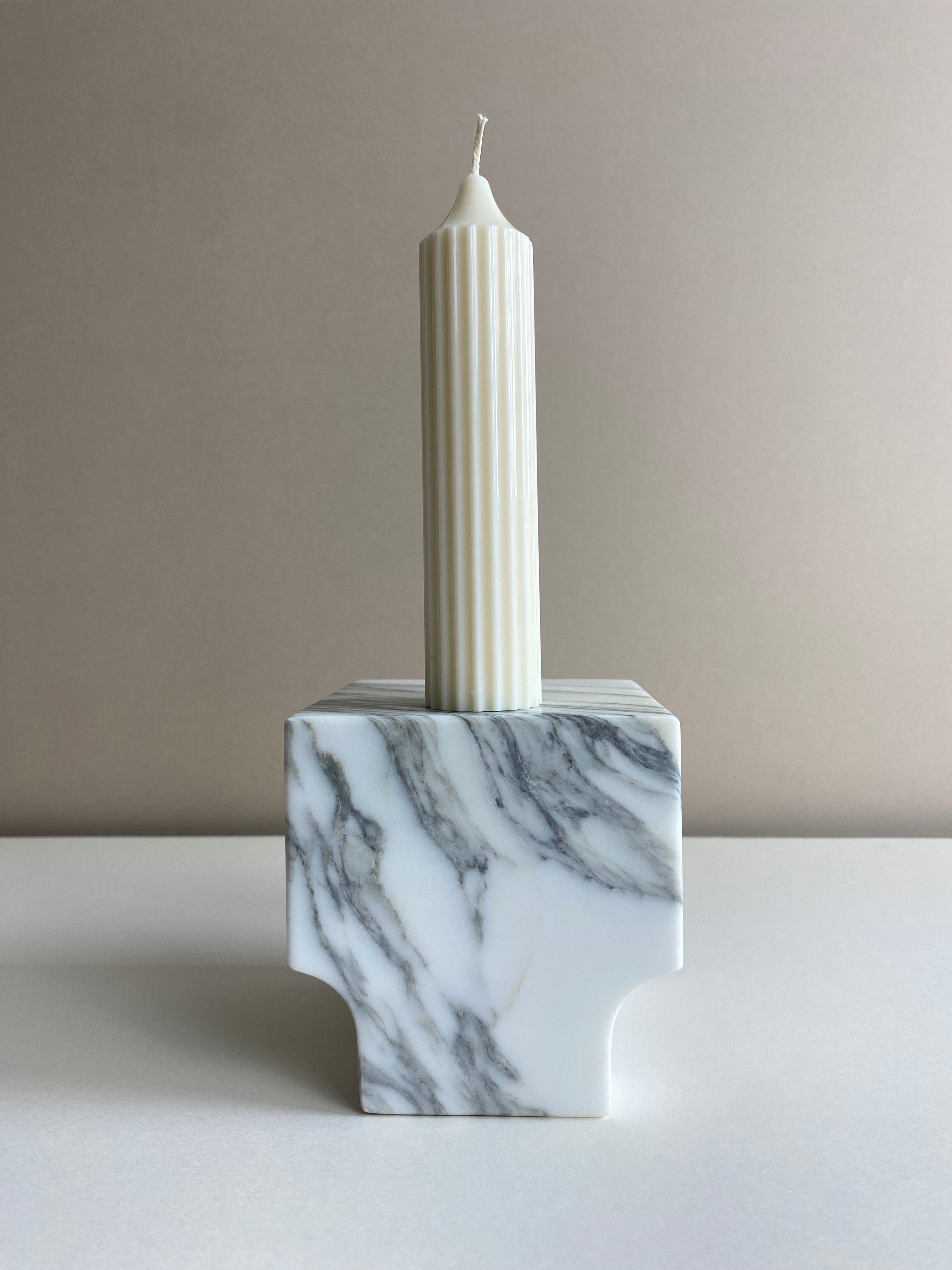 Atelier Ethos Tall Ribbed Pillar Candle Hand-poured in natural soy wax, a candle of sculptural elegance that celebrates artisanal craftsmanship. Sustainable, luxurious, and 10% of profits support charity. £18.00