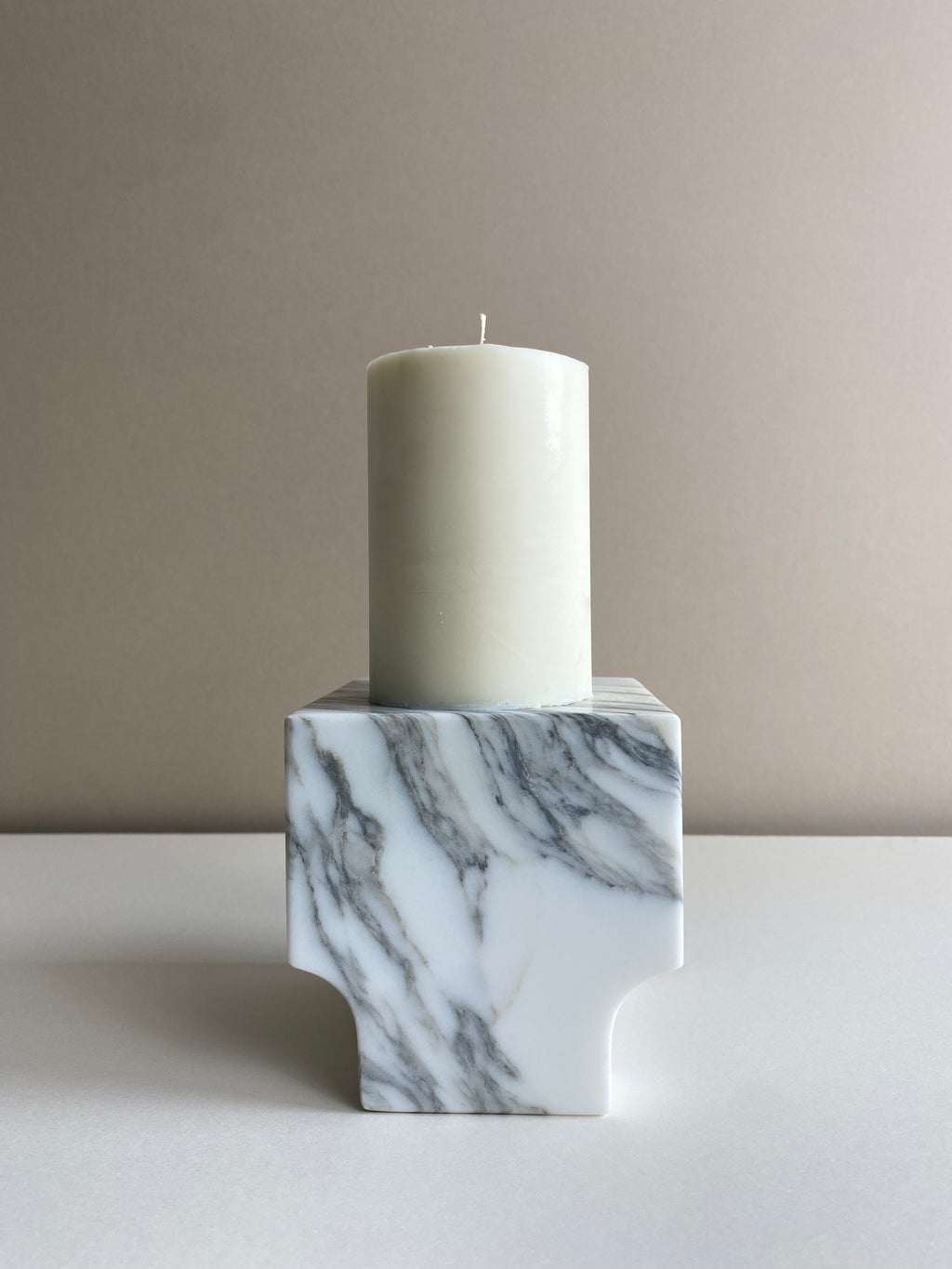 Atelier Ethos Tall Pillar Candle A candle in natural soy wax with elongated, graceful form, showcasing refined craftsmanship. Clean-burning, sustainable, and 10% of profits are donated to charity. £18.00