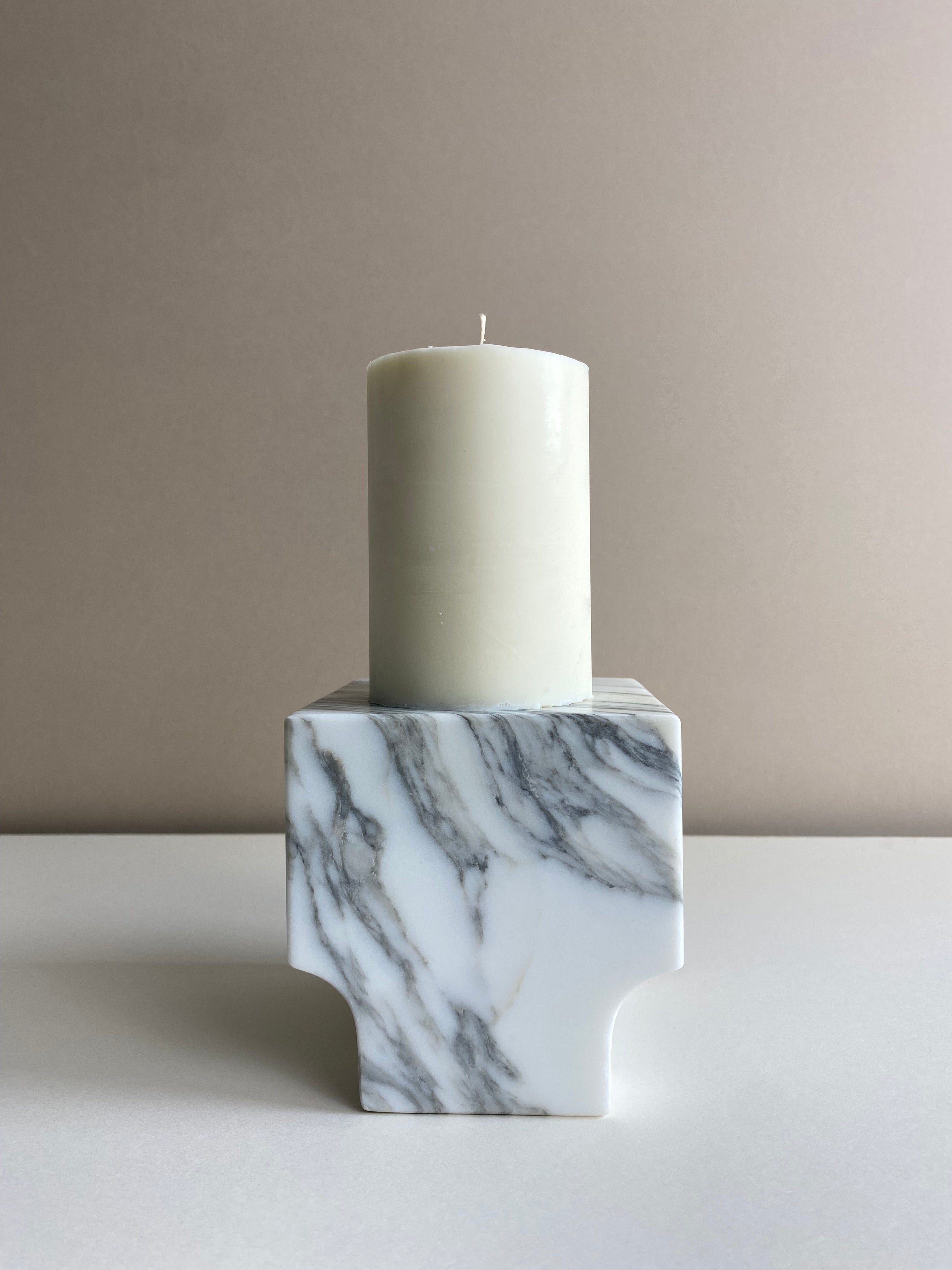 Atelier Ethos Tall Pillar Candle A candle in natural soy wax with elongated, graceful form, showcasing refined craftsmanship. Clean-burning, sustainable, and 10% of profits are donated to charity. £18.00