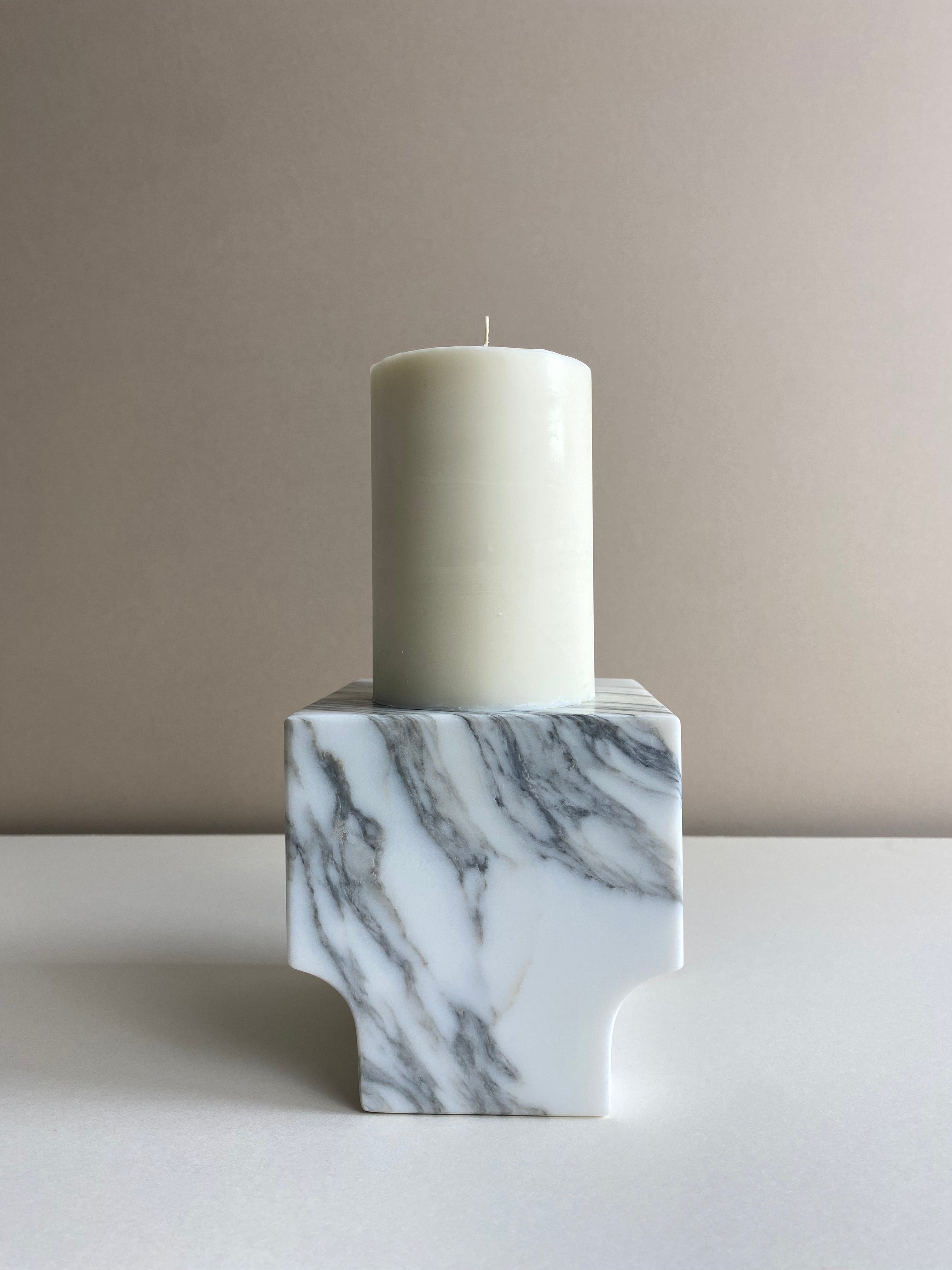 Atelier Ethos Tall Pillar Candle A candle in natural soy wax with elongated, graceful form, showcasing refined craftsmanship. Clean-burning, sustainable, and 10% of profits are donated to charity. £18.00