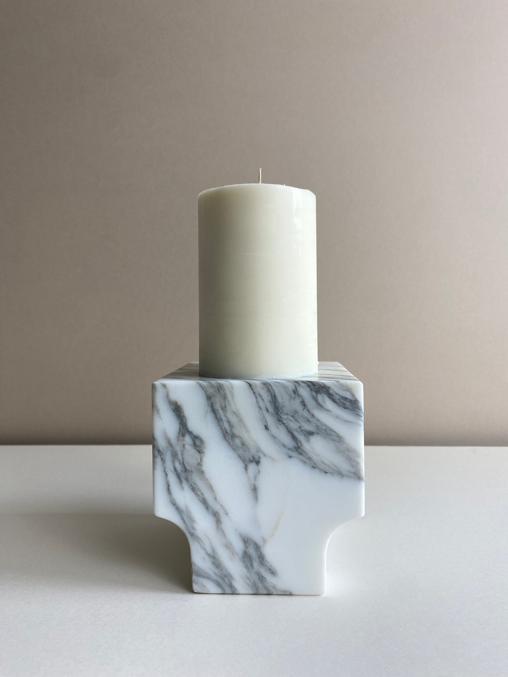 Atelier Ethos Tall Pillar Candle A candle in natural soy wax with elongated, graceful form, showcasing refined craftsmanship. Clean-burning, sustainable, and 10% of profits are donated to charity. £18.00