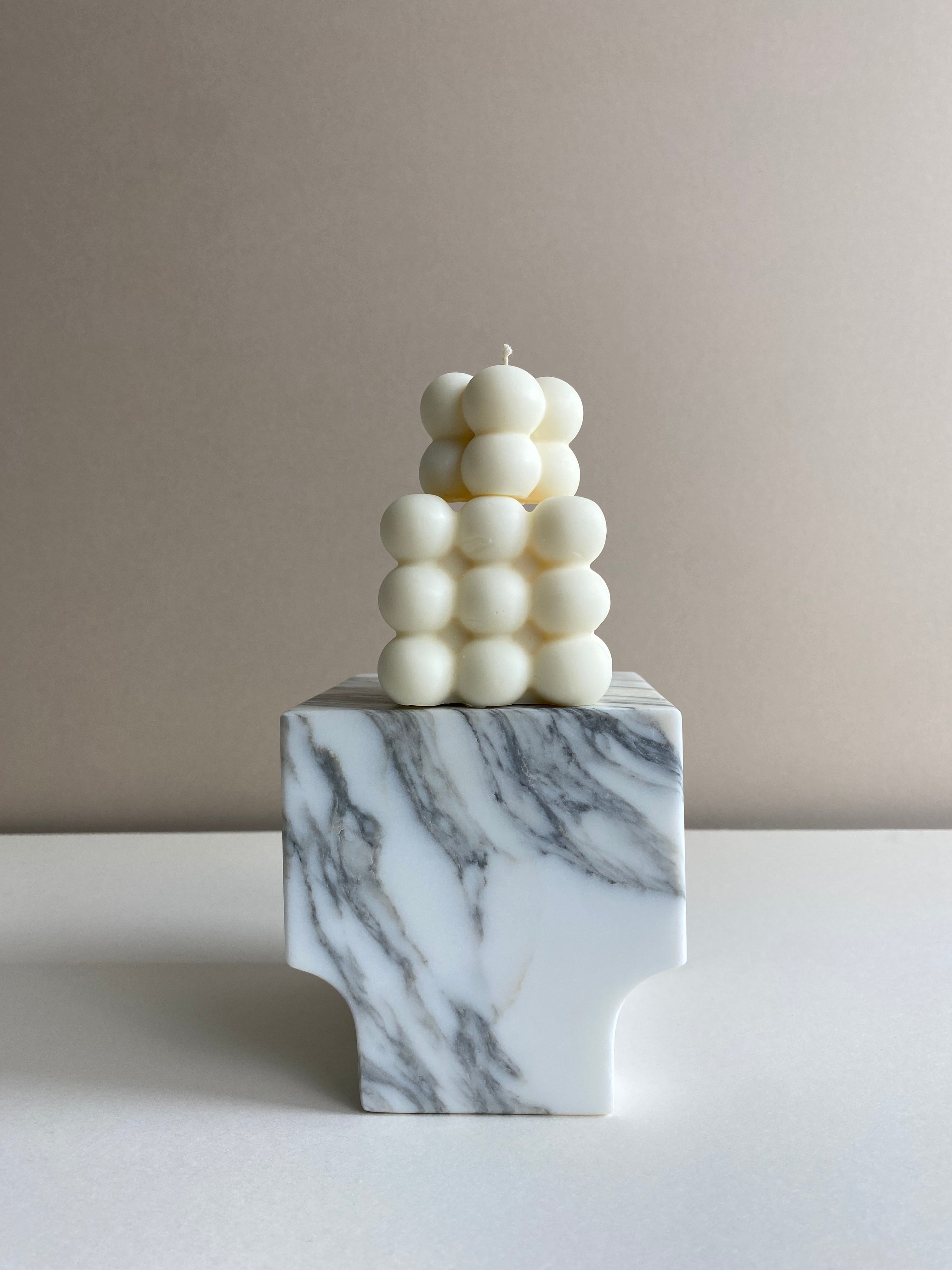 Atelier Ethos Pair Of Bubble Cube Candles Playful and sculptural, a candle pair in natural soy wax combines modern artistry with sustainable luxury. 10% of profits are donated to charity. £12.00