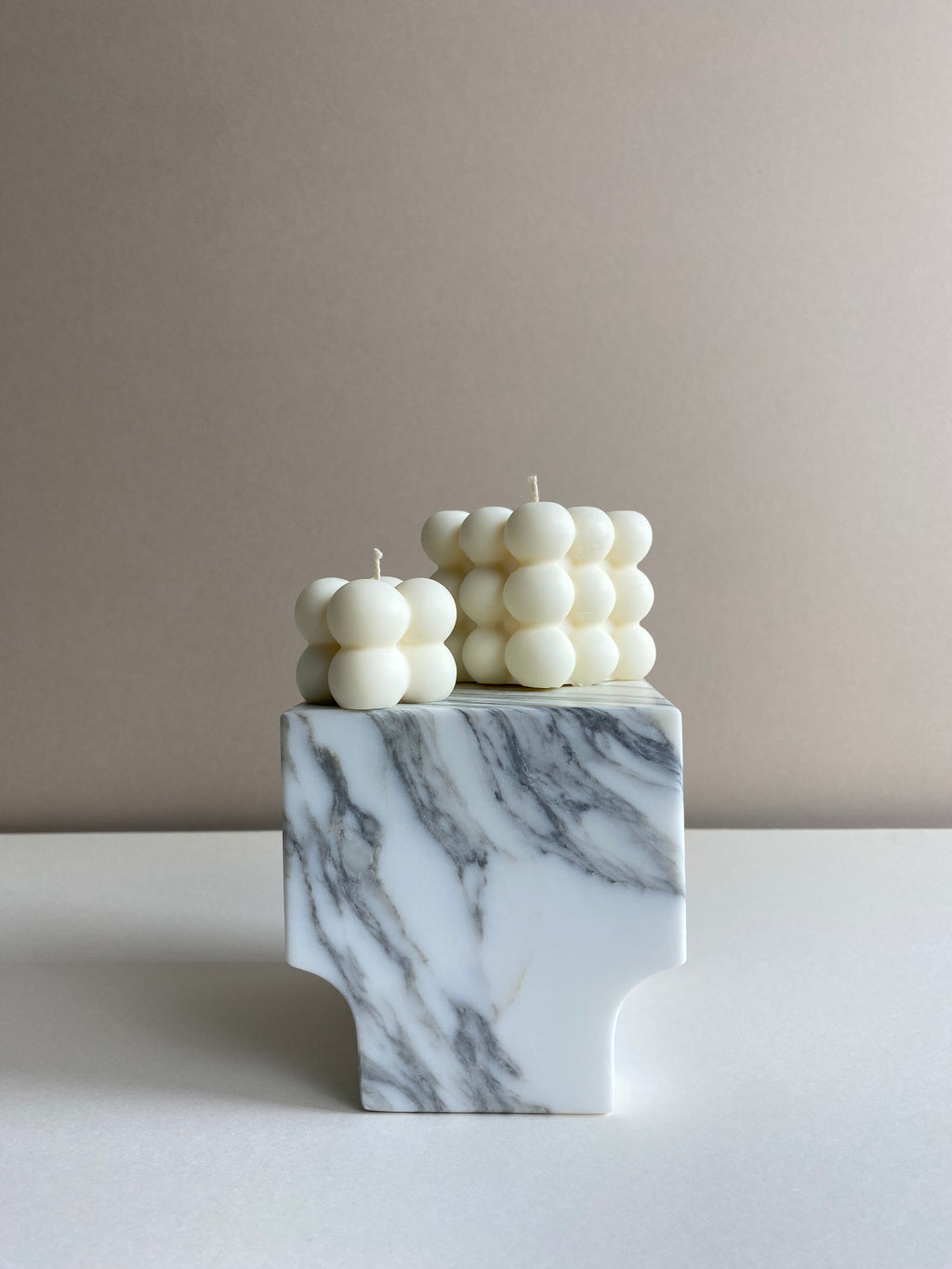 Atelier Ethos Pair Of Bubble Cube Candles Playful and sculptural, a candle pair in natural soy wax combines modern artistry with sustainable luxury. 10% of profits are donated to charity. £12.00
