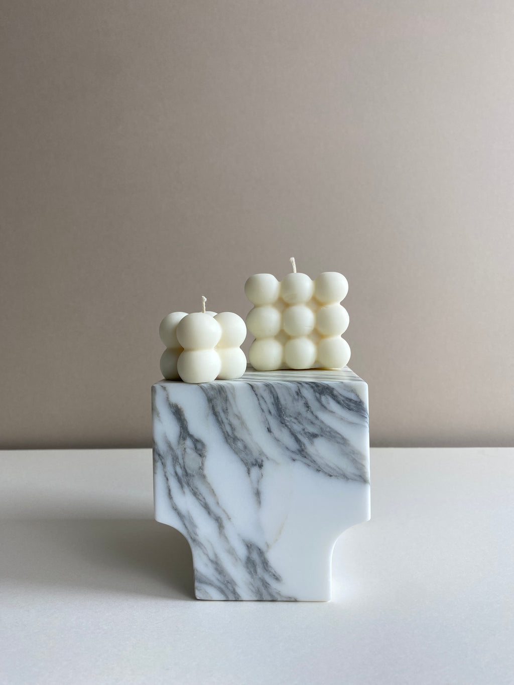 Atelier Ethos Pair Of Bubble Cube Candles Playful and sculptural, a candle pair in natural soy wax combines modern artistry with sustainable luxury. 10% of profits are donated to charity. £12.00