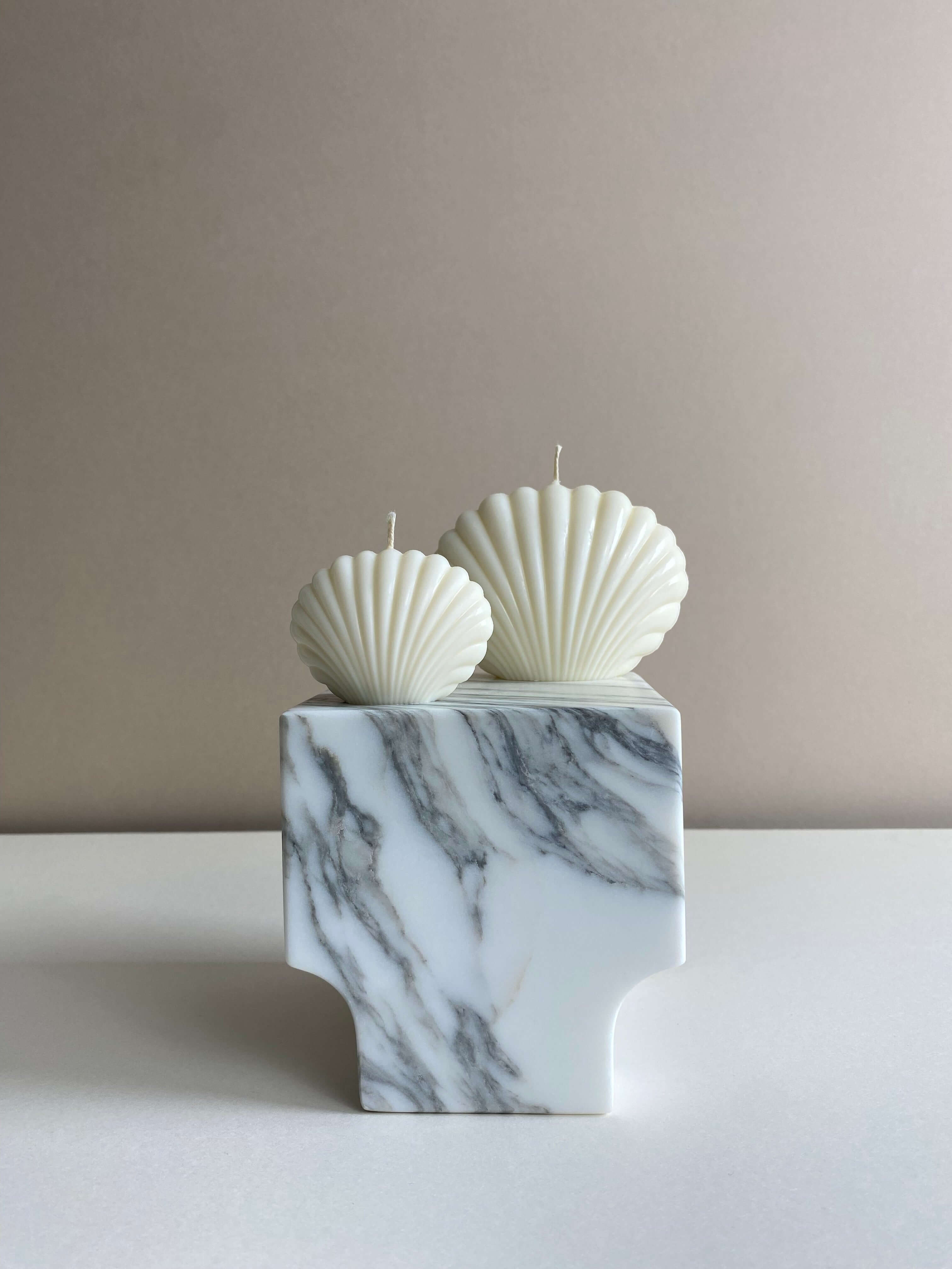Atelier Ethos Pair Of Seashell Candles Evoking coastal elegance, a candle pair in natural soy wax offers sculptural artistry. Sustainable, luxurious, with 10% of profits supporting charity. £11.00