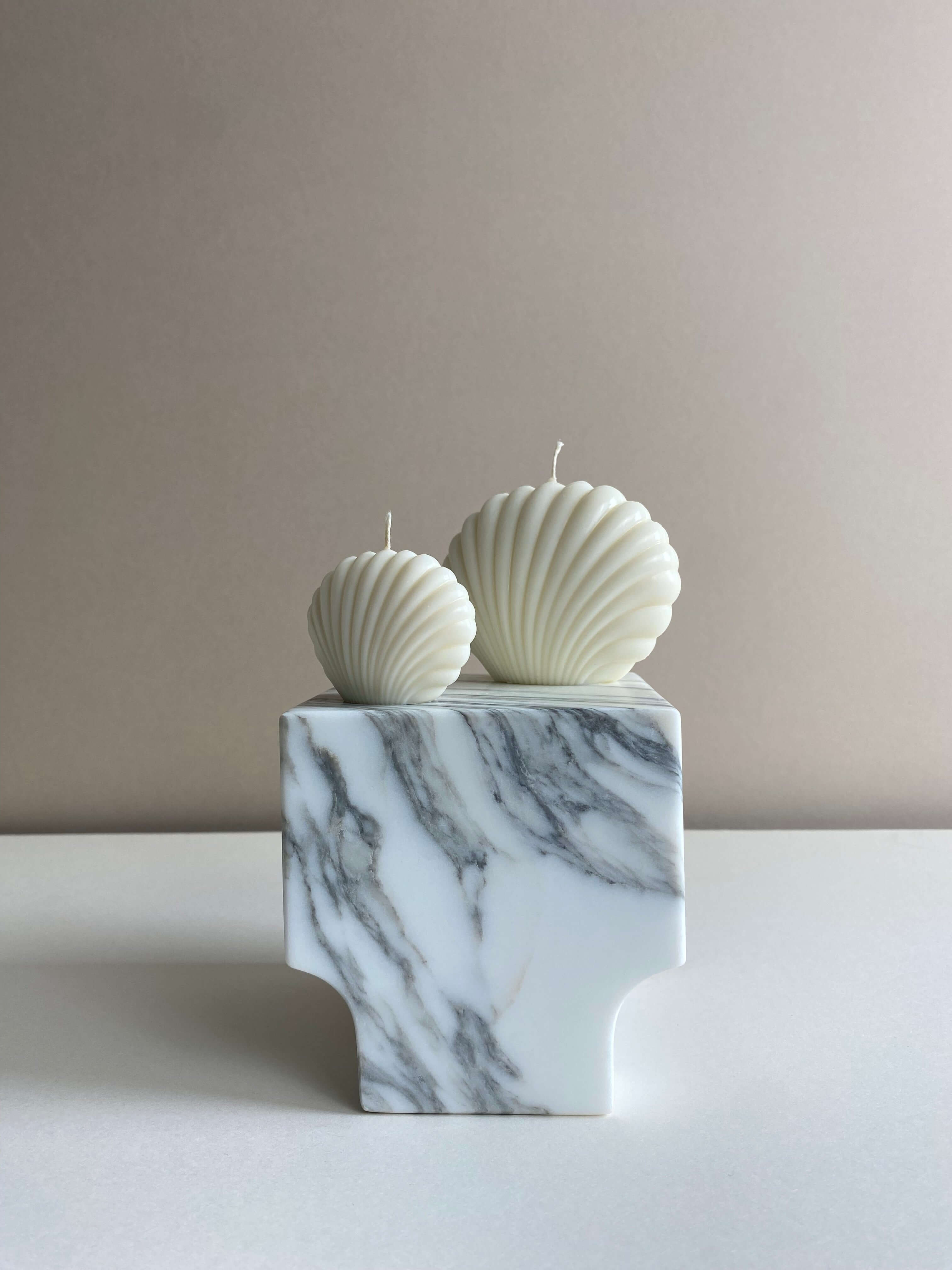 Atelier Ethos Pair Of Seashell Candles Evoking coastal elegance, a candle pair in natural soy wax offers sculptural artistry. Sustainable, luxurious, with 10% of profits supporting charity. £11.00
