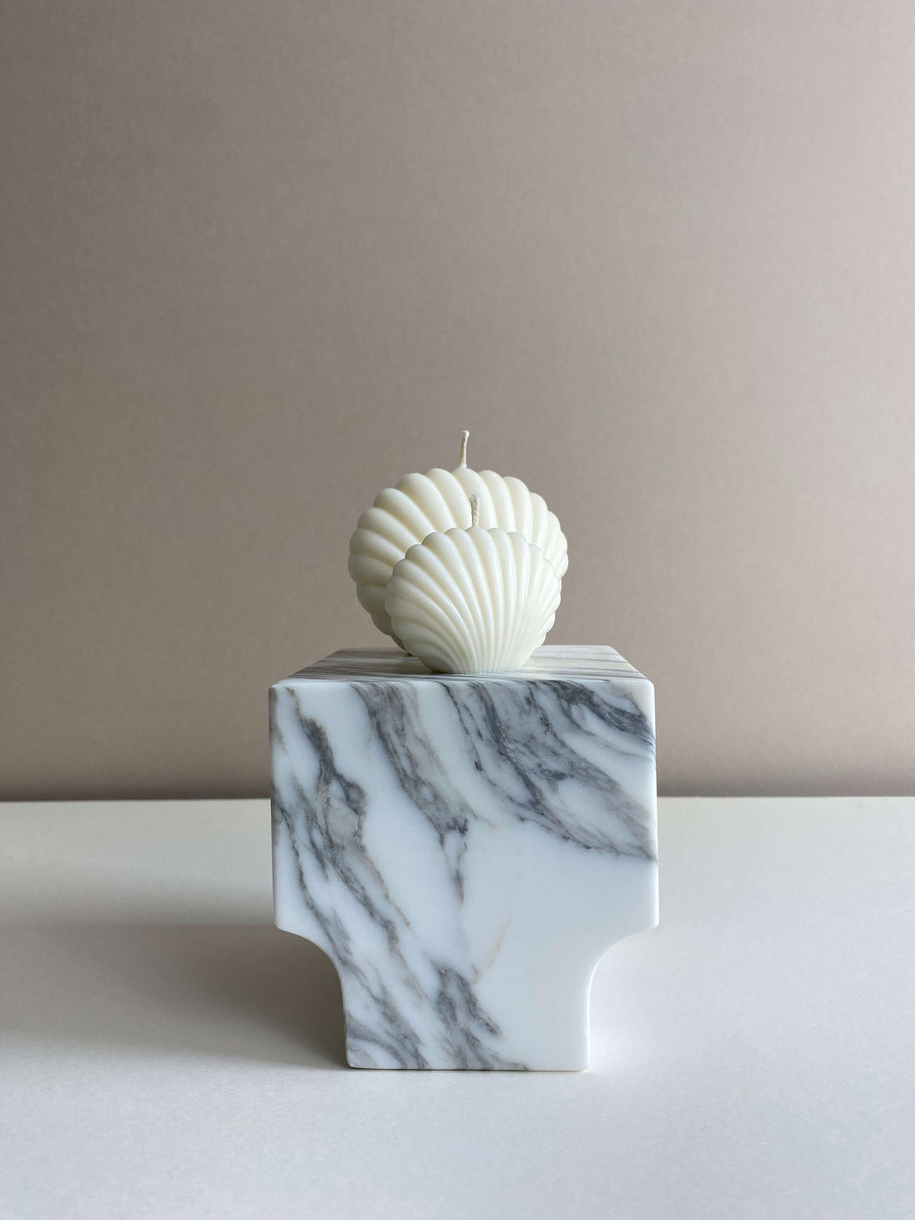 Atelier Ethos Pair Of Seashell Candles Evoking coastal elegance, a candle pair in natural soy wax offers sculptural artistry. Sustainable, luxurious, with 10% of profits supporting charity. £11.00
