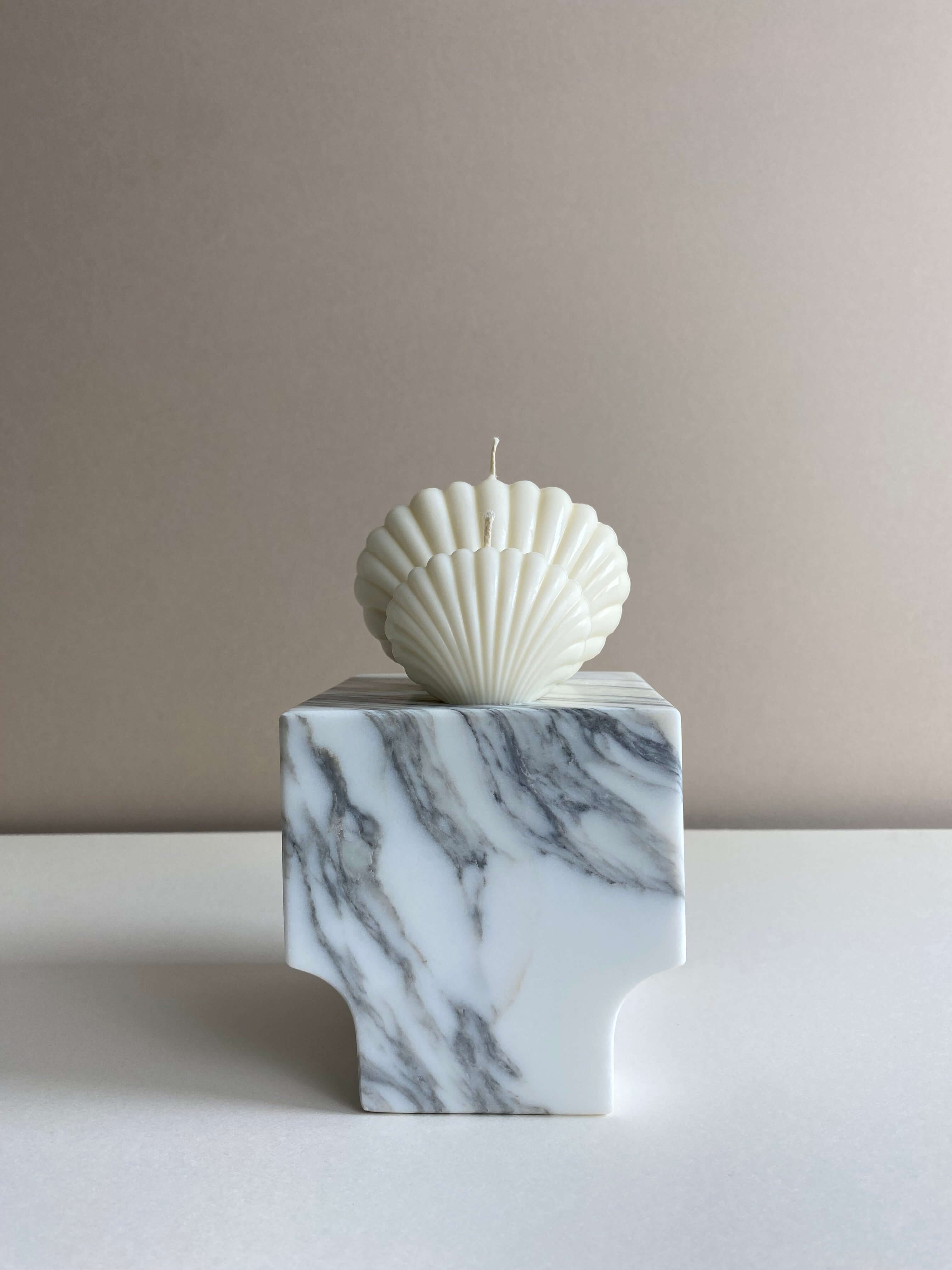 Atelier Ethos Pair Of Seashell Candles Evoking coastal elegance, a candle pair in natural soy wax offers sculptural artistry. Sustainable, luxurious, with 10% of profits supporting charity. £11.00